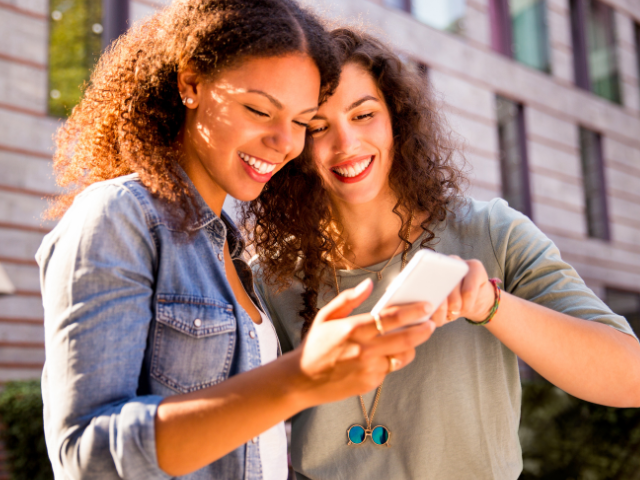 Two women looking at Memrise community word lists